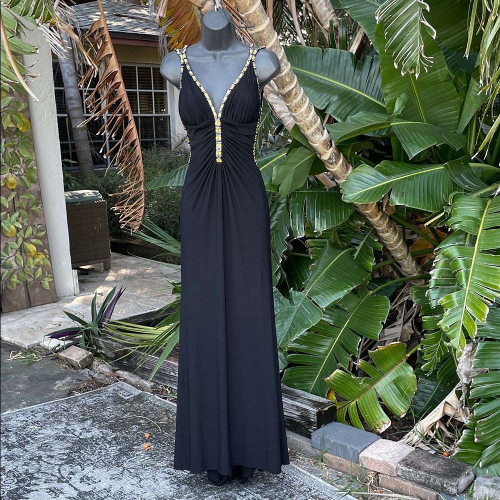 La femme  gold jewel trim, deep, cut backless gown